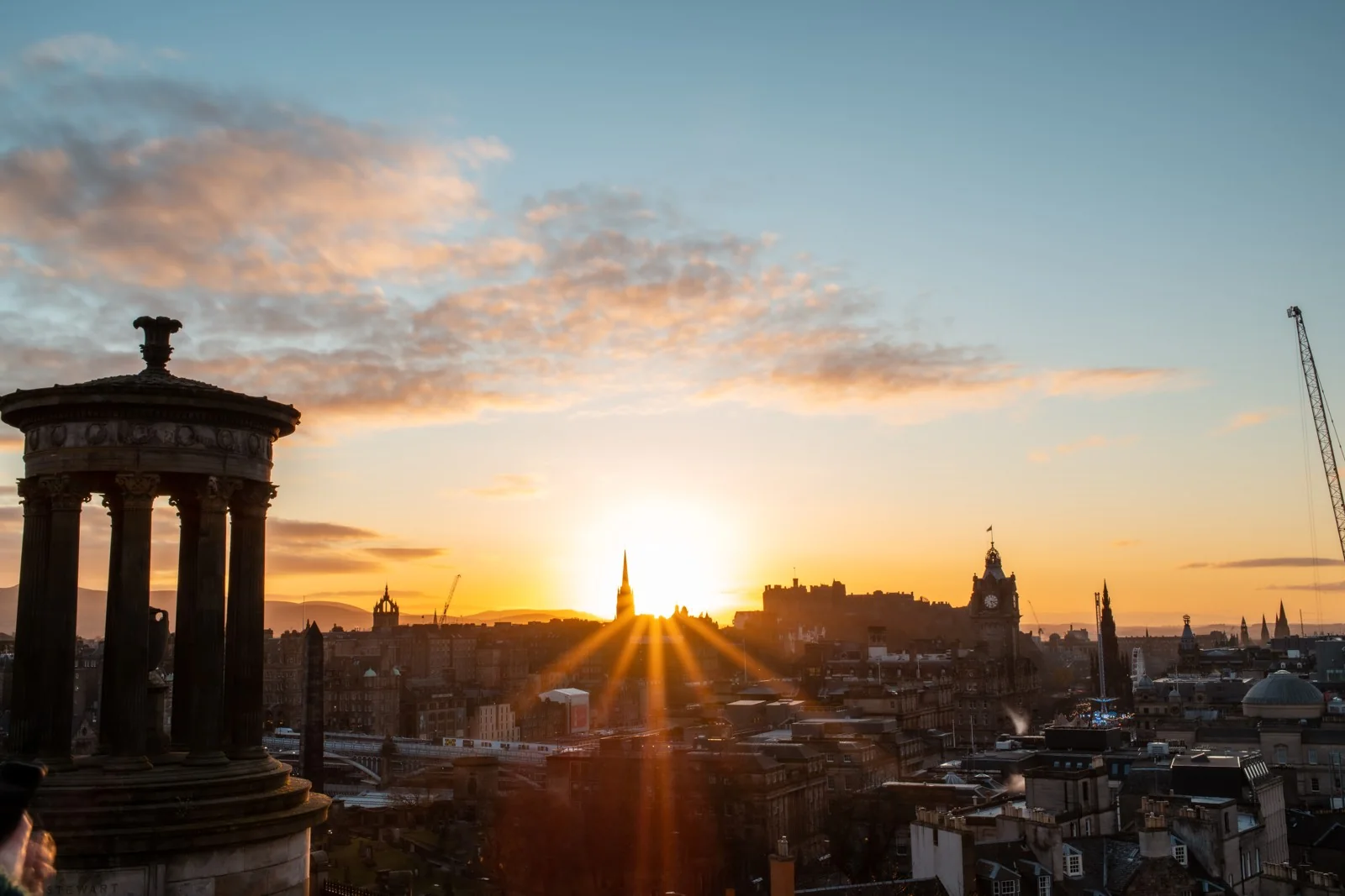 Warm light across Edinburgh's skyline from Calton Hill